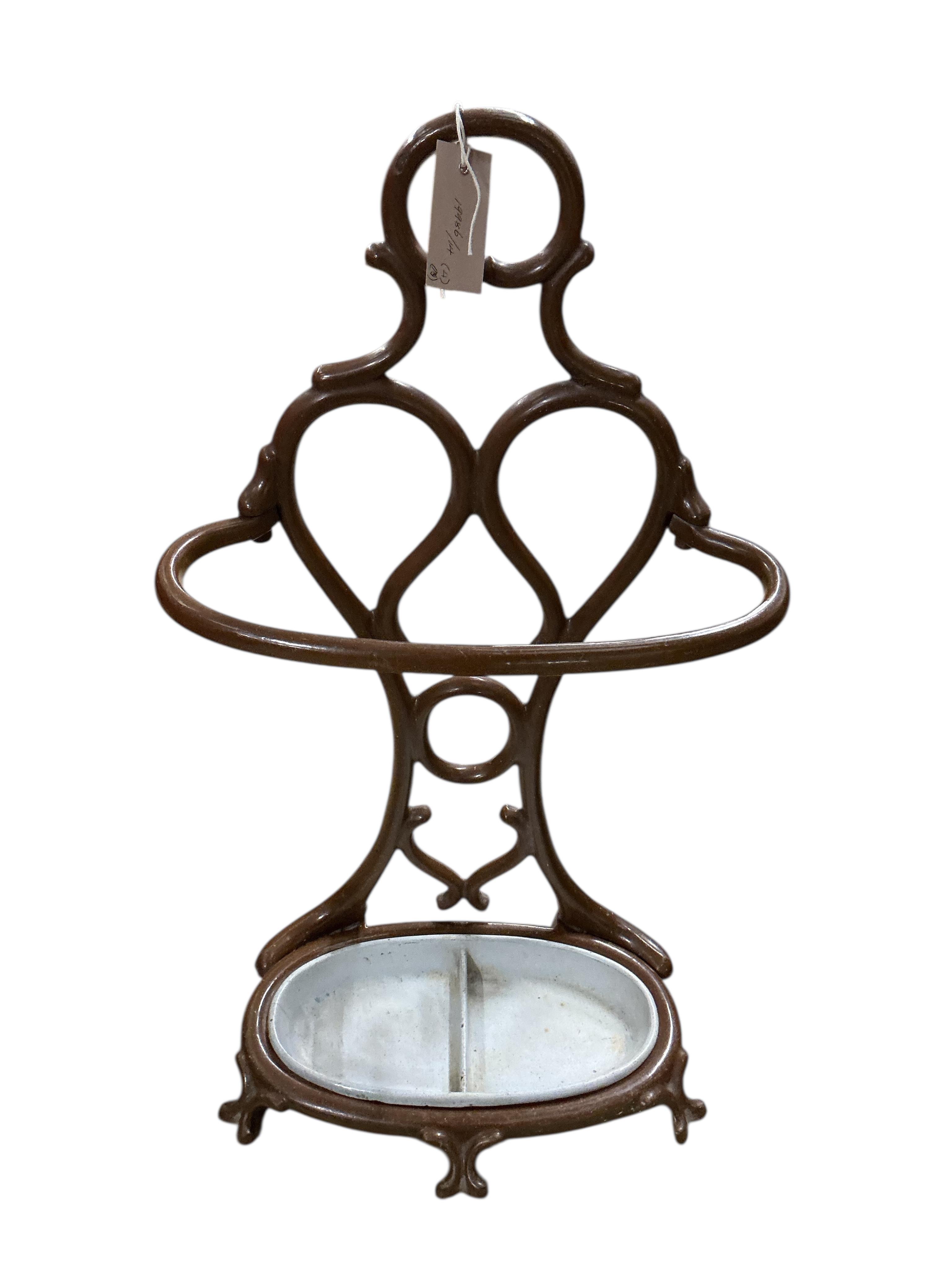 A late Victorian painted cast iron stick-stand, height 70cm, two Victorian cast iron boot scrapers and a square pail